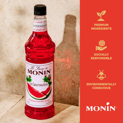 Monin syrup being added to a cocktail glass to show mixing ease and vivid fruit taste
