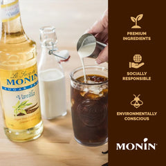Monin syrup being poured into iced coffee illustrating easy blending
