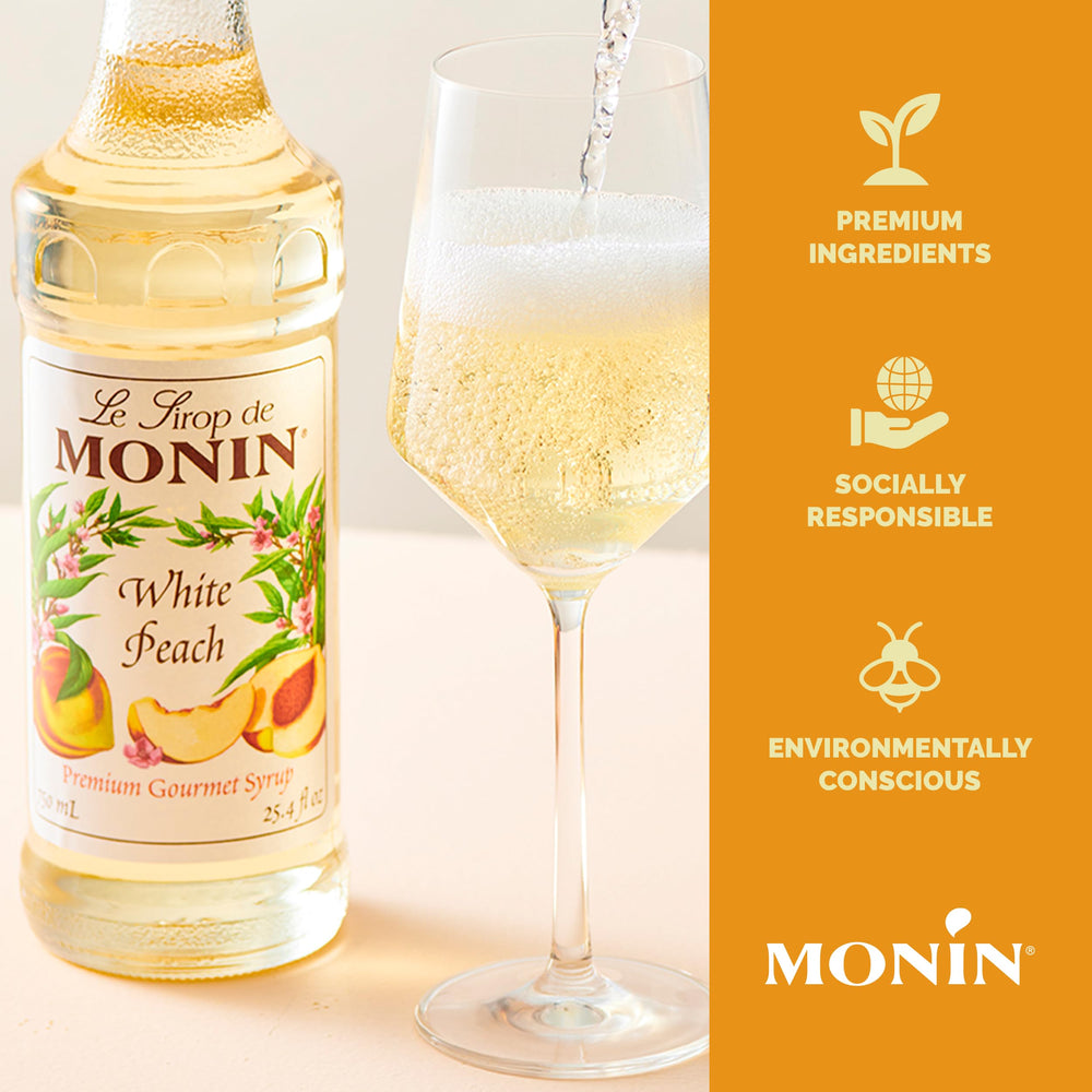 Monin white peach syrup texture over ice illustrating easy mixing and clarity