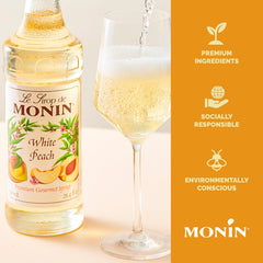 Monin white peach syrup texture over ice illustrating easy mixing and clarity
