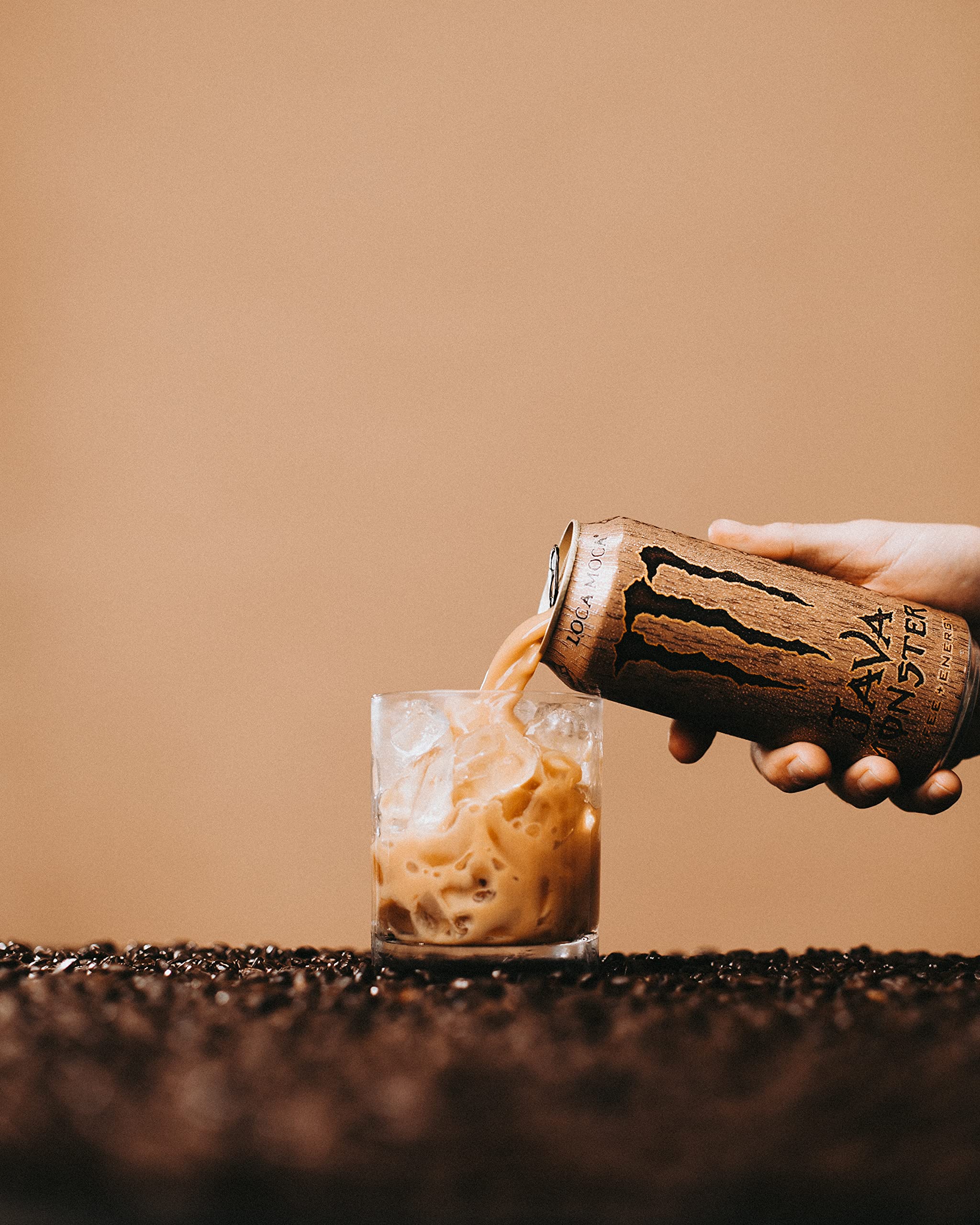 Monster held in hand outdoors showing portability and on-the-go energy