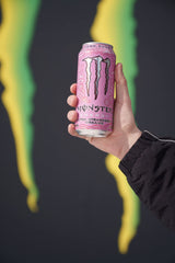 Monster Ultra Strawberry Dreams open can being poured for refreshment