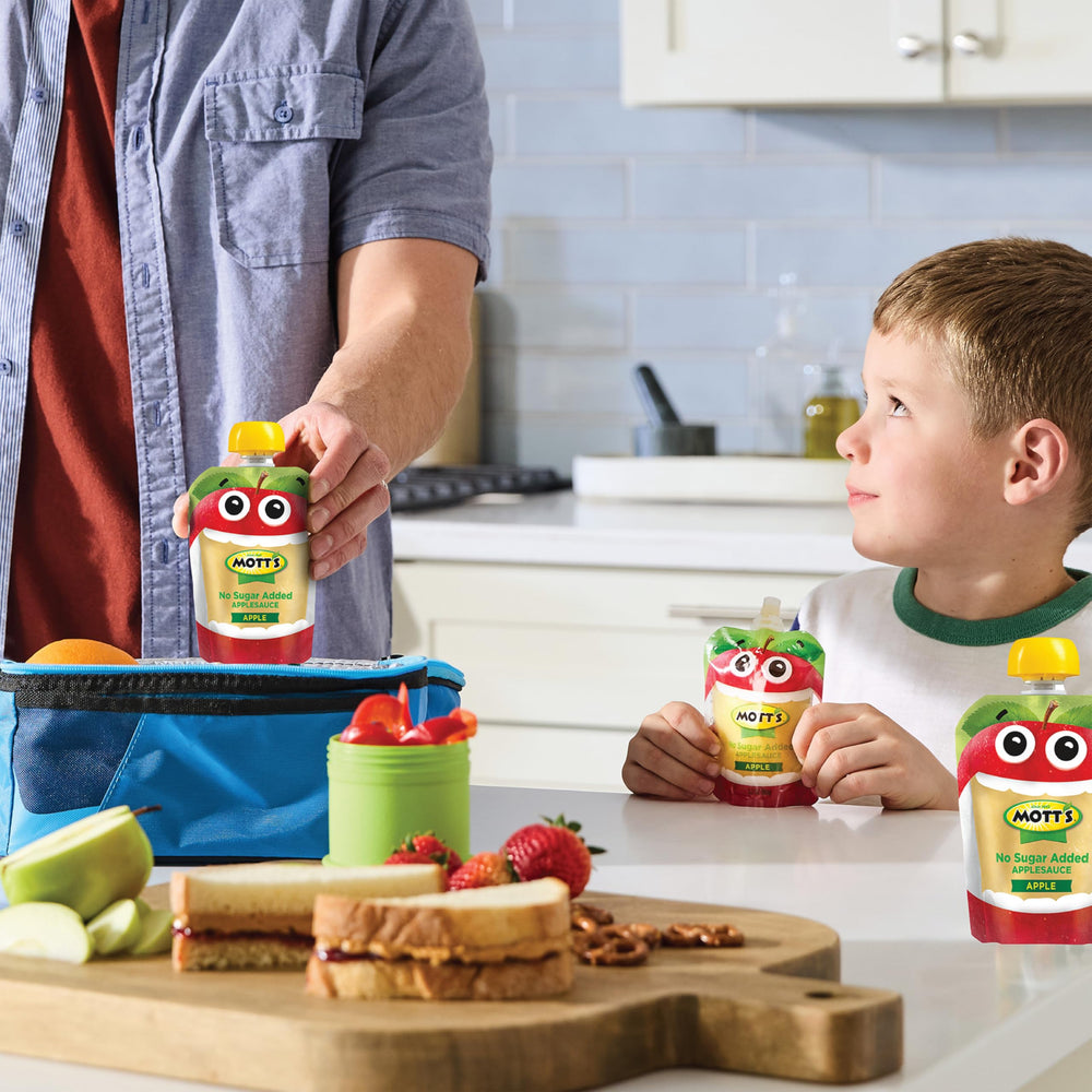 Mott's several pouches inside a lunchbox illustrating convenient packed-snack benefit