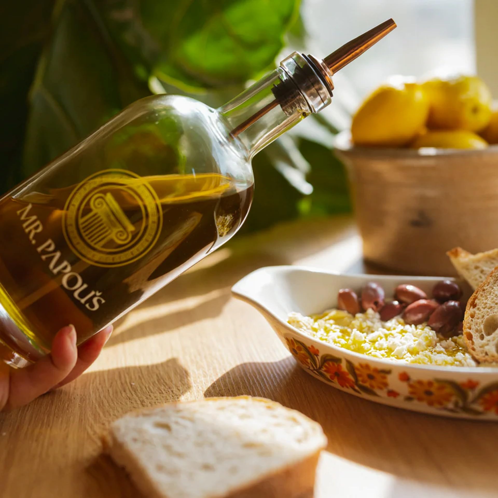 Mr. Papou's olive oil pouring spout in action for precise control benefit