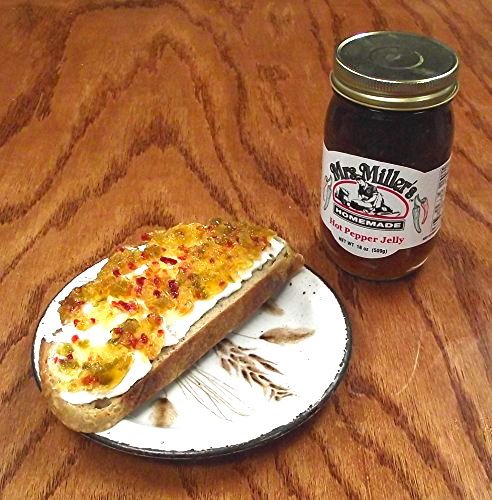 Mrs. Miller's jelly spooned over cream cheese on crackers creating quick appetizer