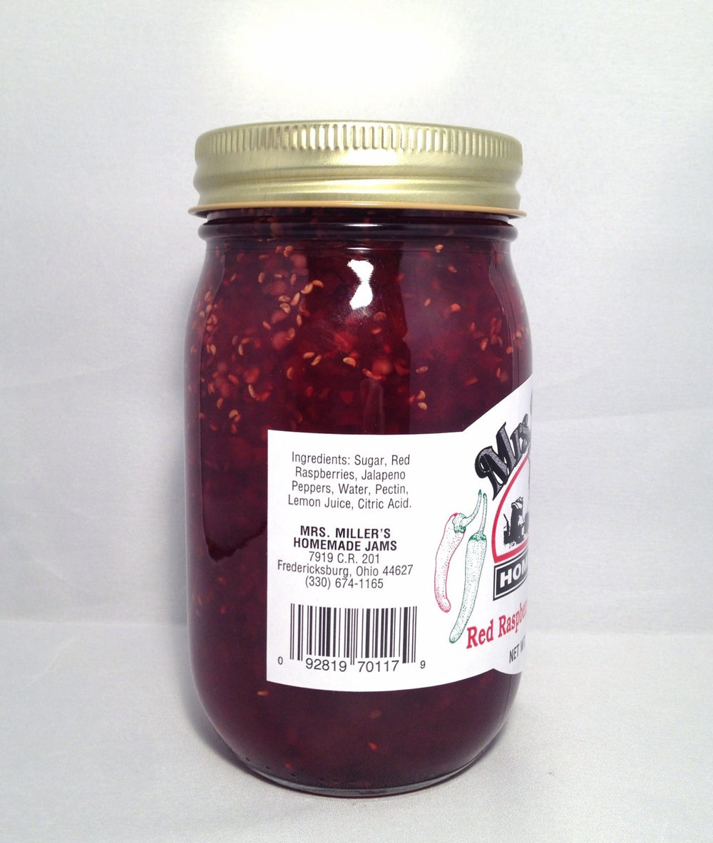 Mrs. Miller's jam on a spoon showing chunky texture, highlights natural fruit pieces