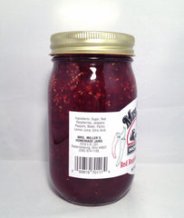 Mrs. Miller's jam on a spoon showing chunky texture, highlights natural fruit pieces