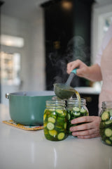 Mrs. Wages pickles packed in glass jars ready to refrigerate and enjoy
