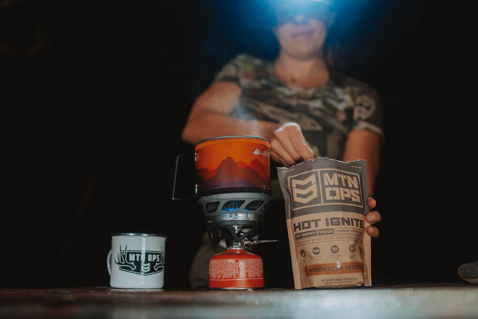 MTN OPS lifestyle scene with user drinking Charged Cocoa before a workout for focus