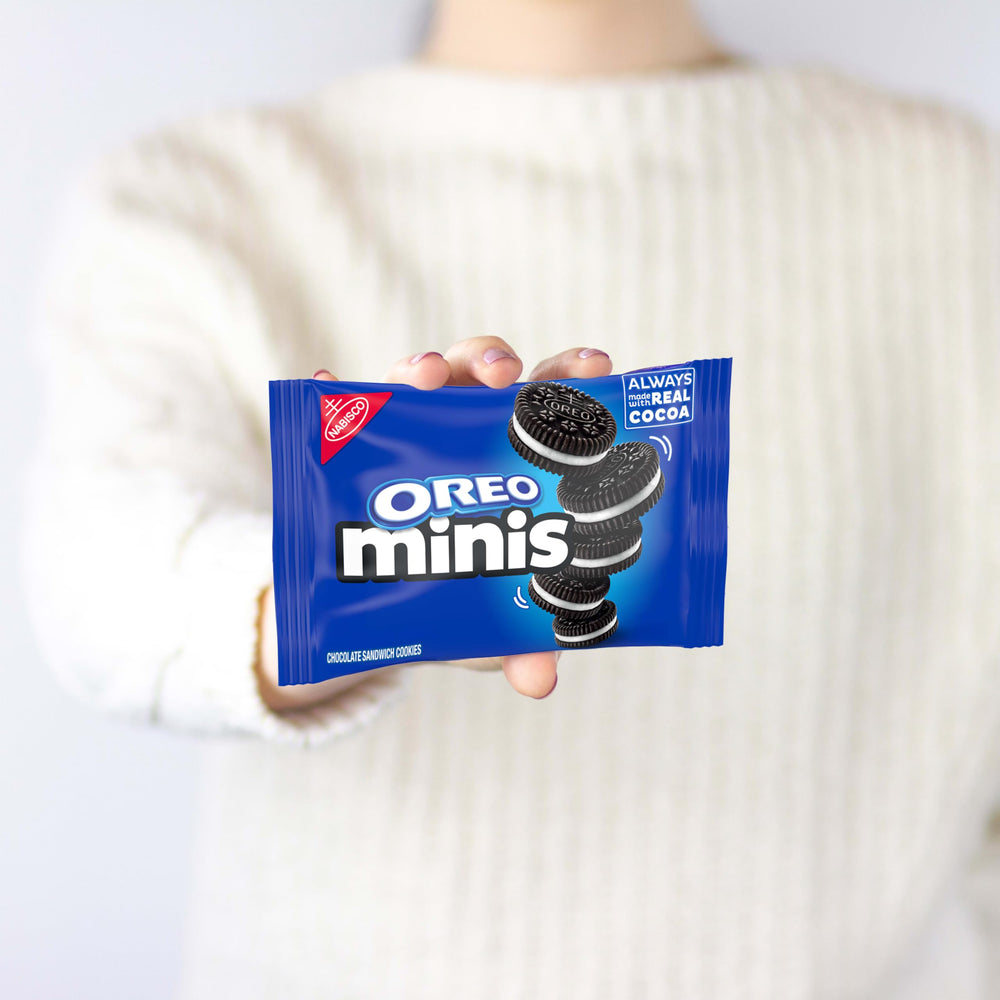 NABISCO snack pack in hand for scale showing portable, travel-friendly size