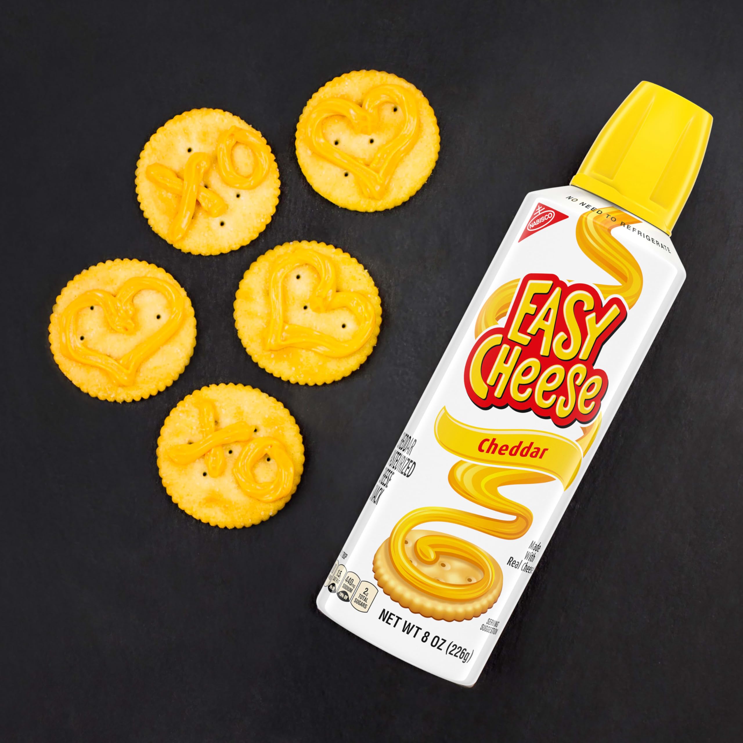 NABISCO RITZ stacked crackers beside a hand for size and portion guidance