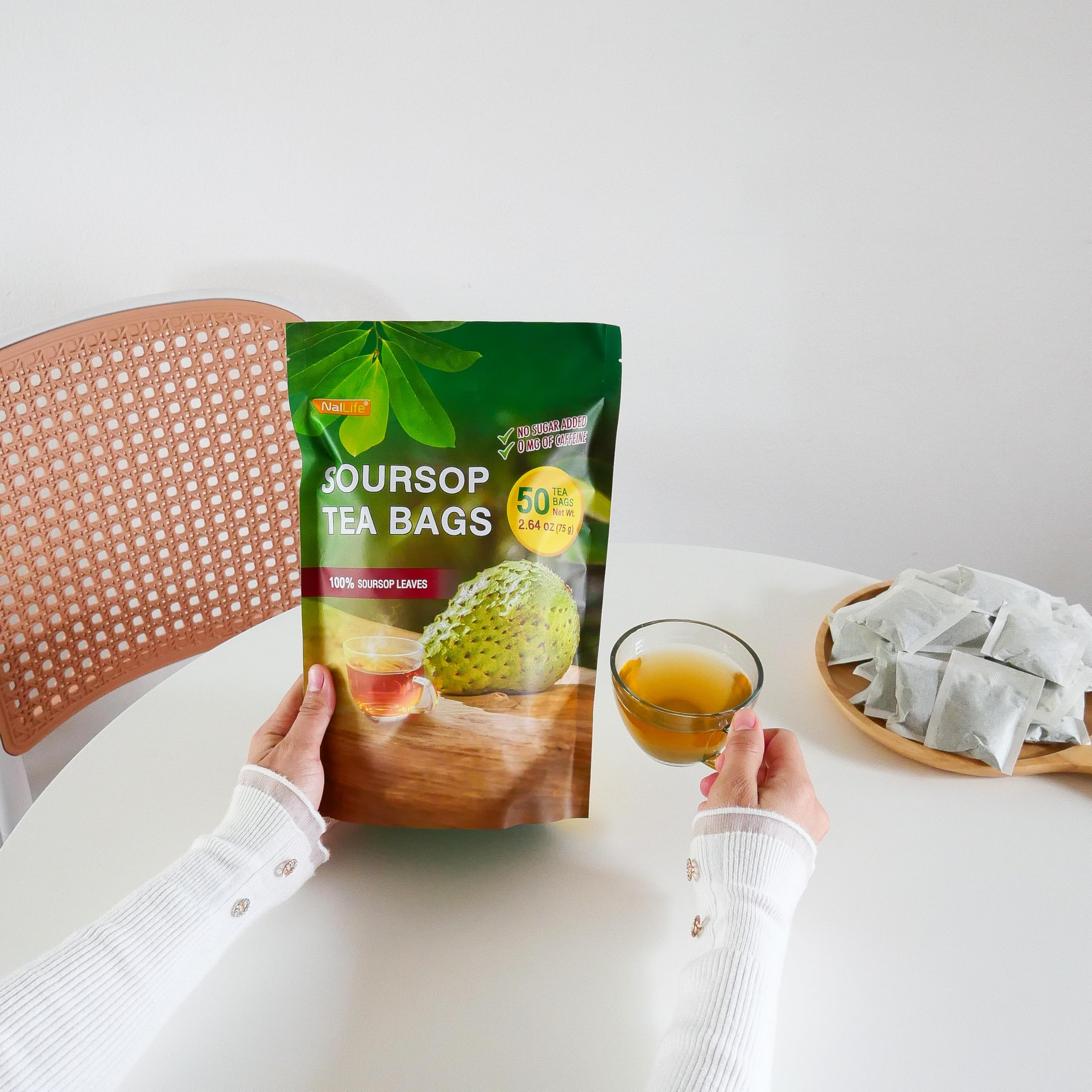 NalLife scale comparison with hand to show tea bag size and portioning