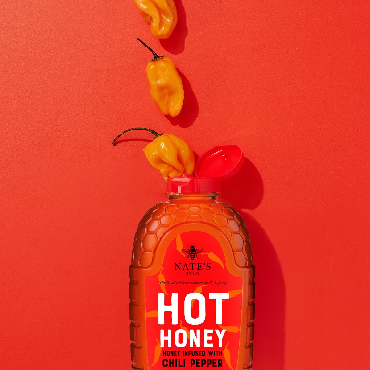 Nate's Honey close-up of habanero flakes inside bottle highlighting real chili inclusion and flavor