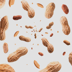 Naturalee peanuts in hand showing 2 lb bag portion control benefit