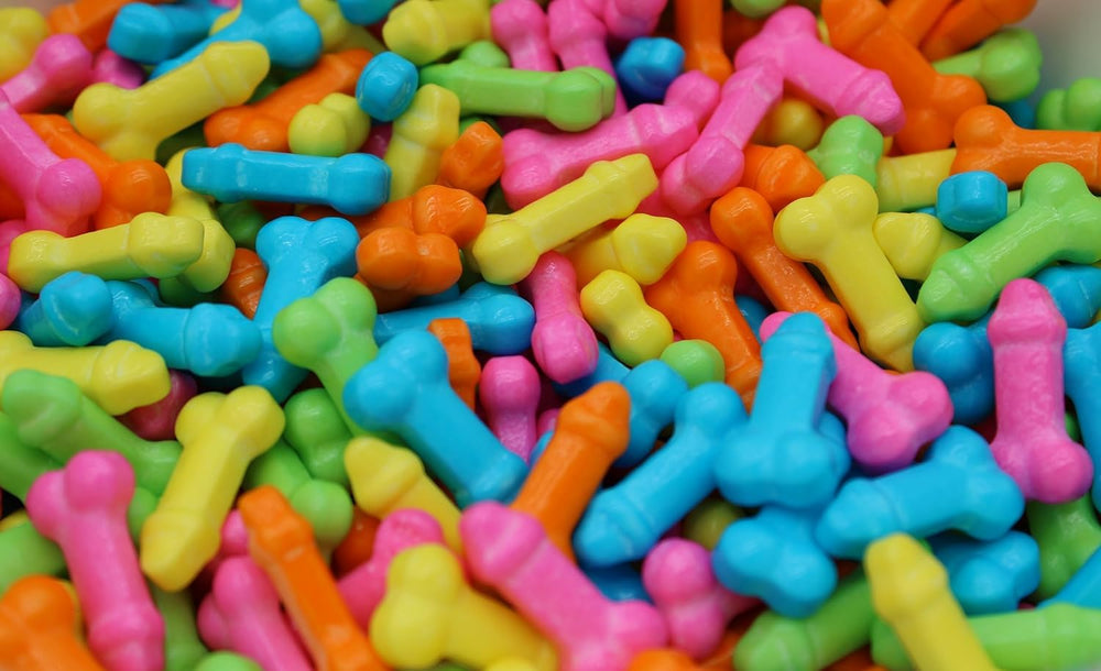 Naturejam close-up of candy pieces scattered on table, useful for party decoration