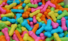 Naturejam close-up of candy pieces scattered on table, useful for party decoration