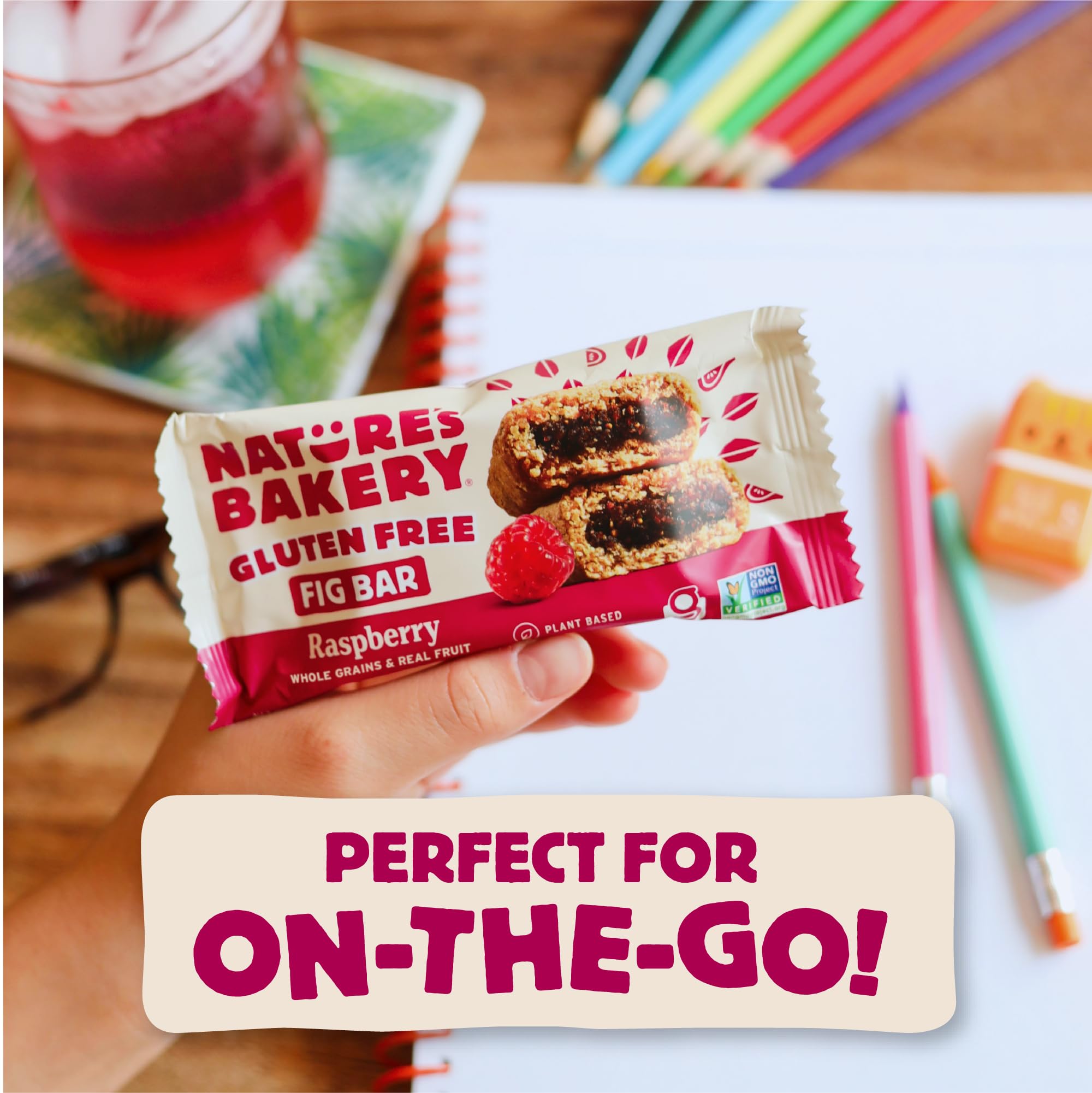 Nature's Bakery bar in hand showing actual 2-ounce size for portion guidance