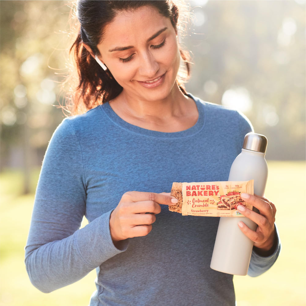 Nature's Bakery bar in hand for size comparison and on-the-go convenience