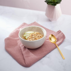 Nature's Path oats and dried apple pieces close-up, wholesome ingredient clarity