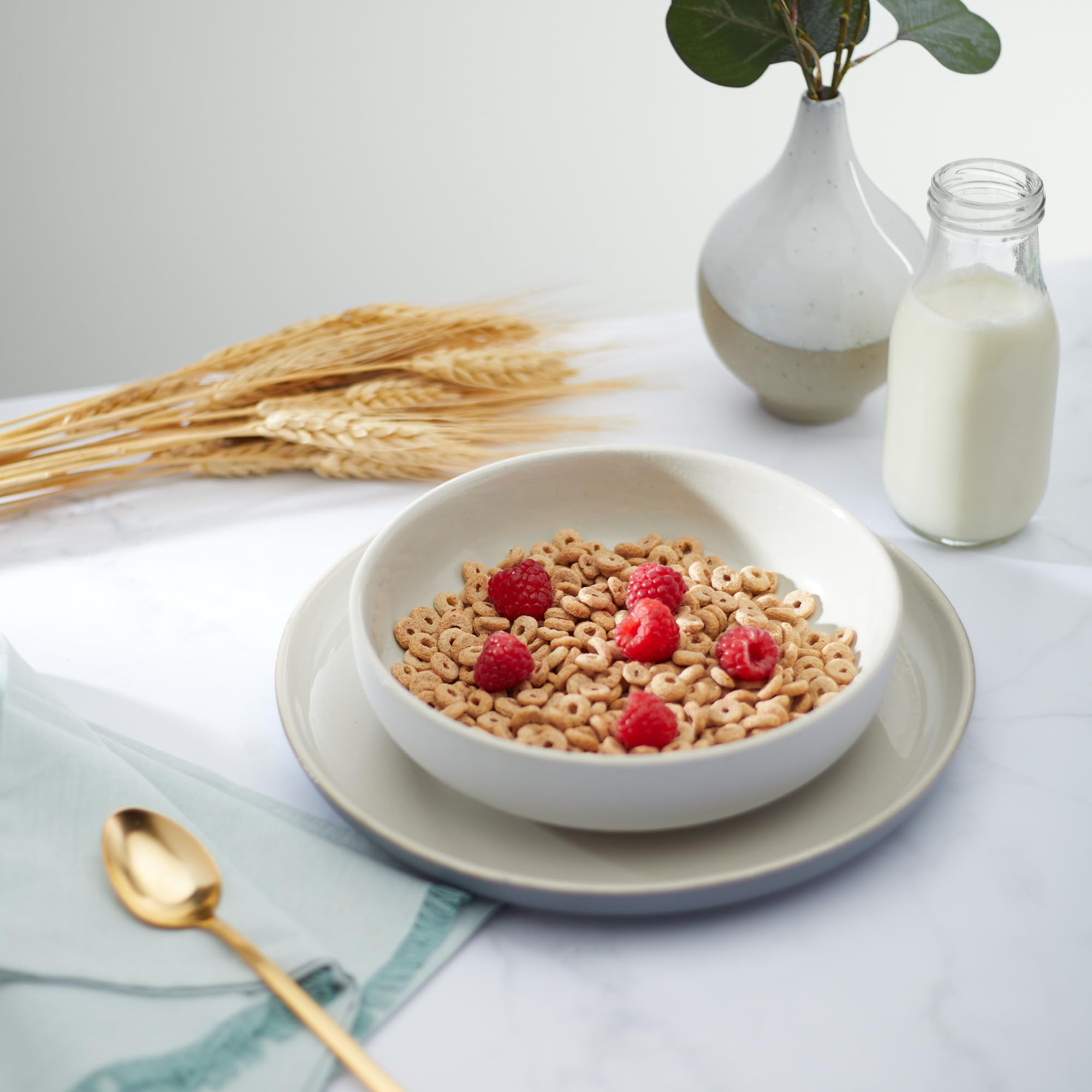 Nature's Path spoonful over yogurt showing versatility and satisfying crunch