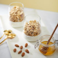 Nature's Path spoon serving granola over yogurt showing convenient breakfast pairing