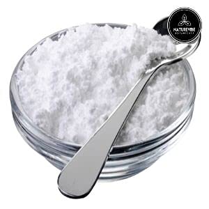 Naturevibe Botanicals wooden spoon with arrowroot powder ready to measure and use