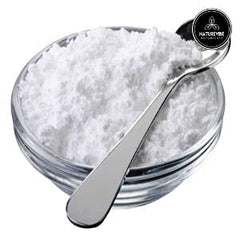 Naturevibe Botanicals wooden spoon with arrowroot powder ready to measure and use