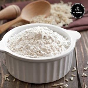 Naturevibe Botanicals spoon scooping finely milled flour highlighting silky particle size