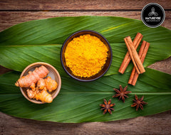 Naturevibe Botanicals close-up texture of ground turmeric showing fine grind and vibrant color benefit
