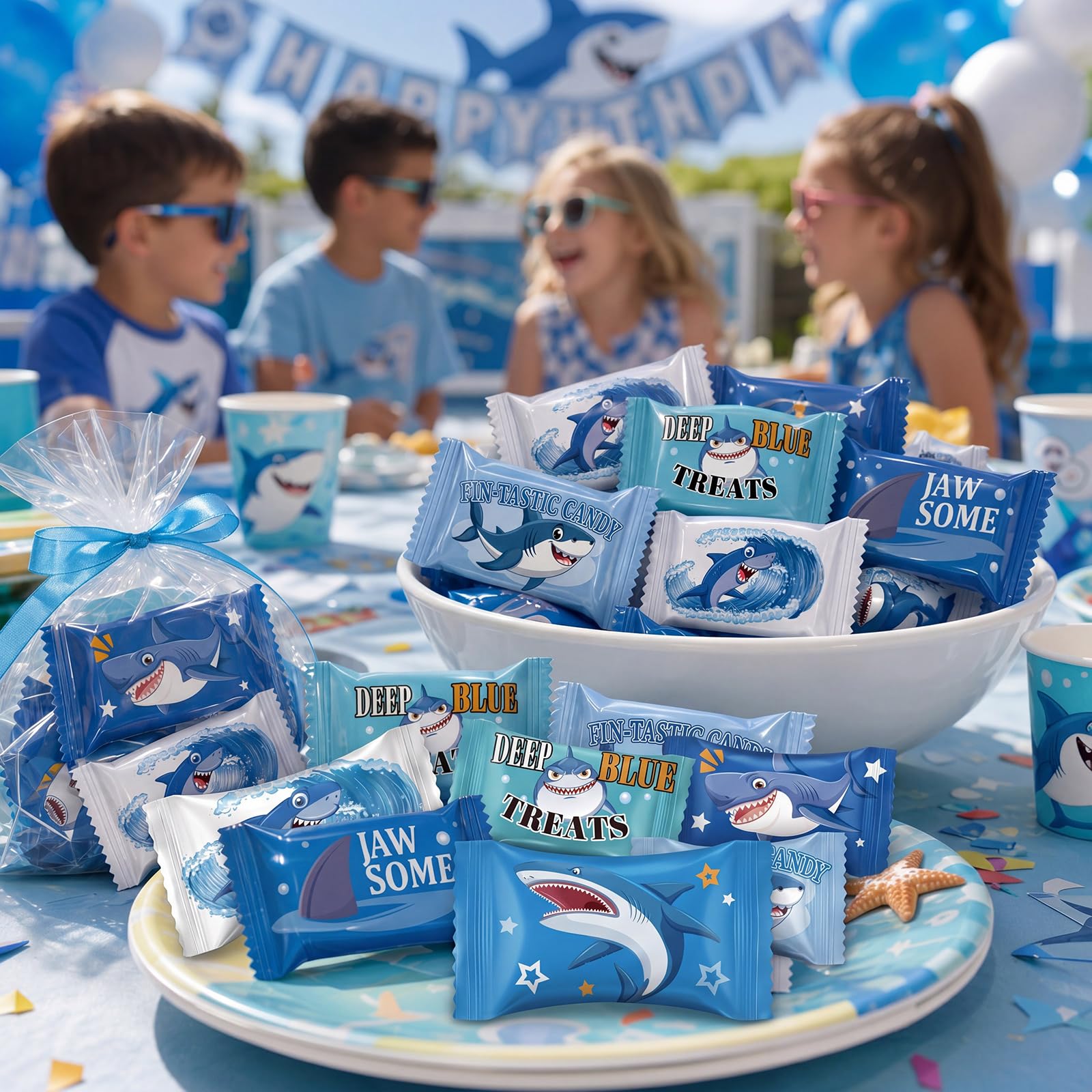 Naucoos candies on a birthday table with shark decor enhancing ocean-themed celebrations