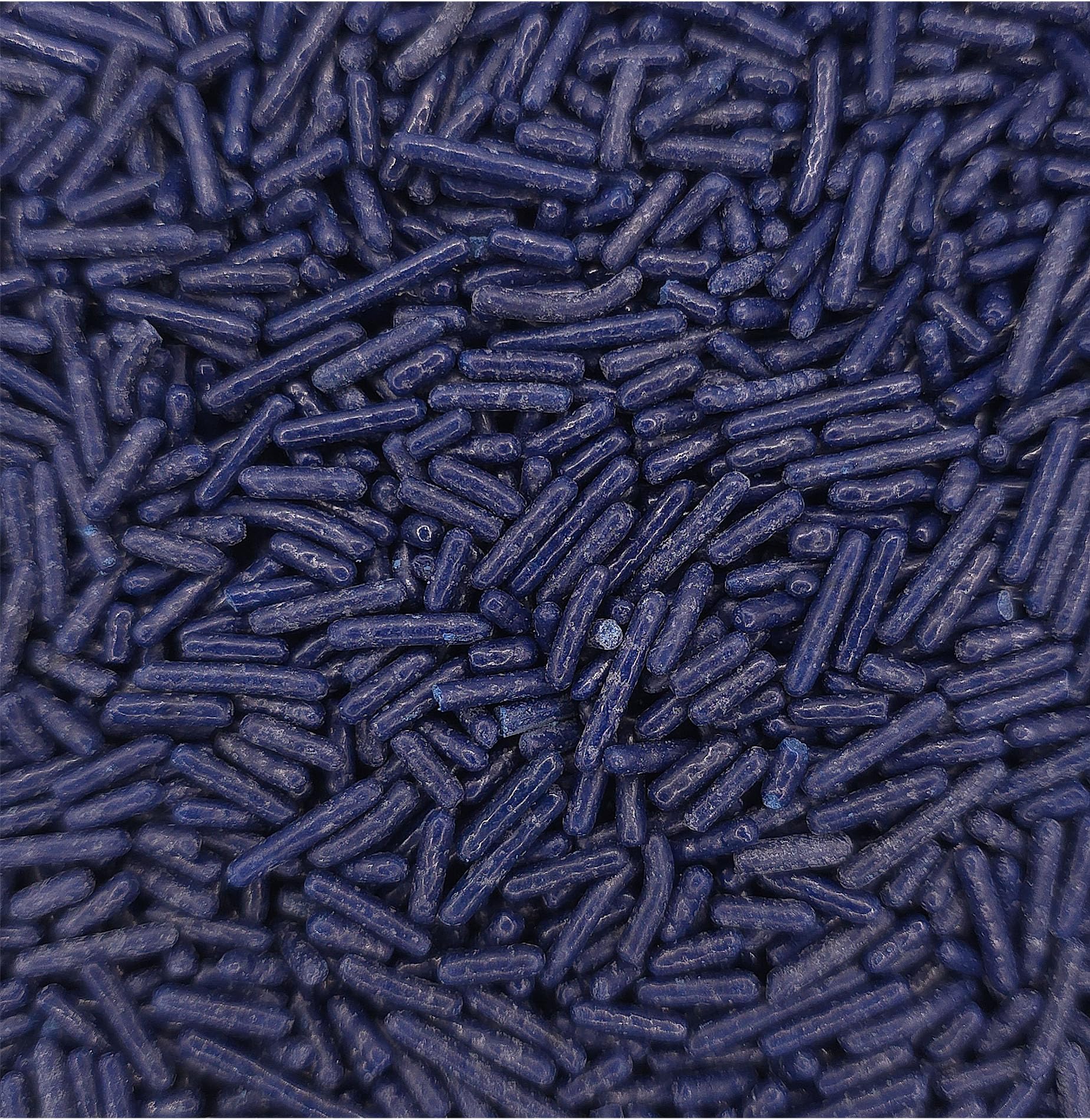 NCS jimmies on cupcake adding bold navy color and contrast