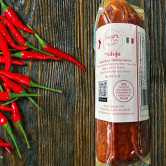 Nduja USA front packaging showing label and cylinder, highlights artisan quality