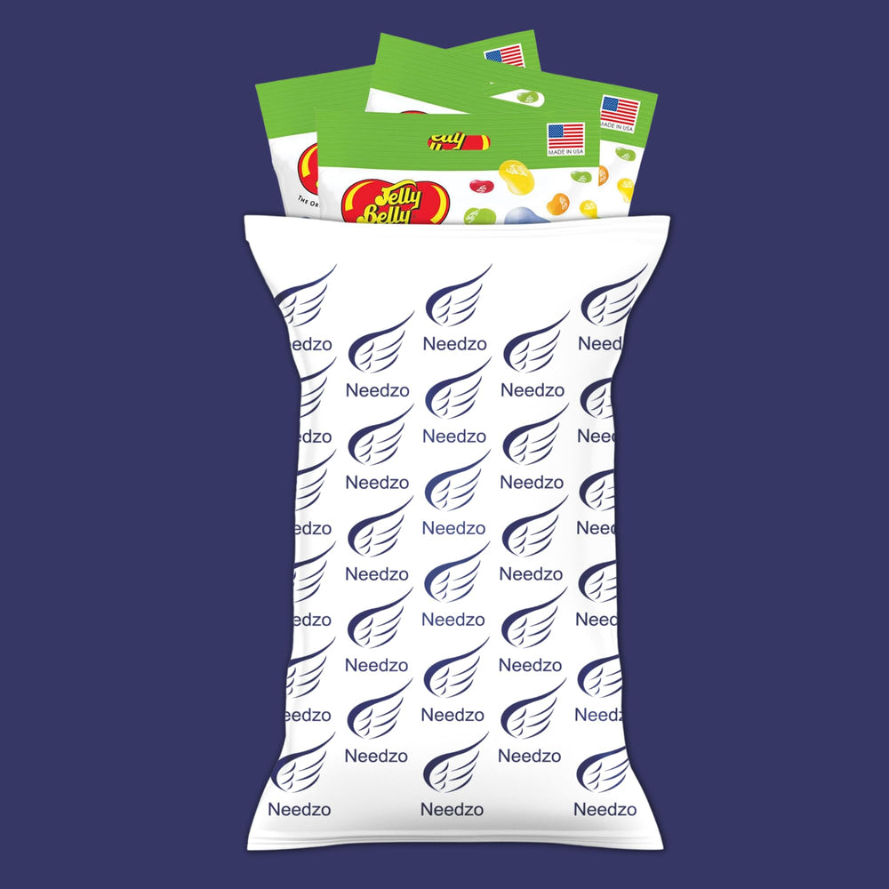 Needzo handheld pouch being eaten demonstrating portable snacking convenience