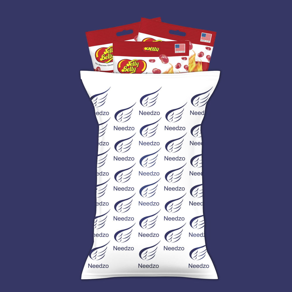 Needzo beans next to a measuring spoon to show portion size and shareable quantity