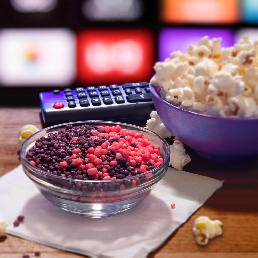 Nerds theater box held in hand showing compact size and portability