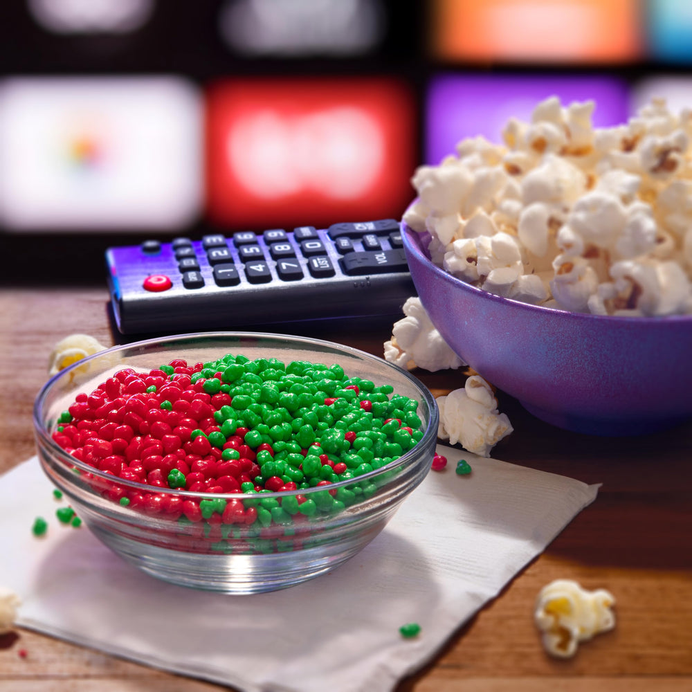 NERDS open box in hand showing dual chambers and easy pour for on-the-go snacking