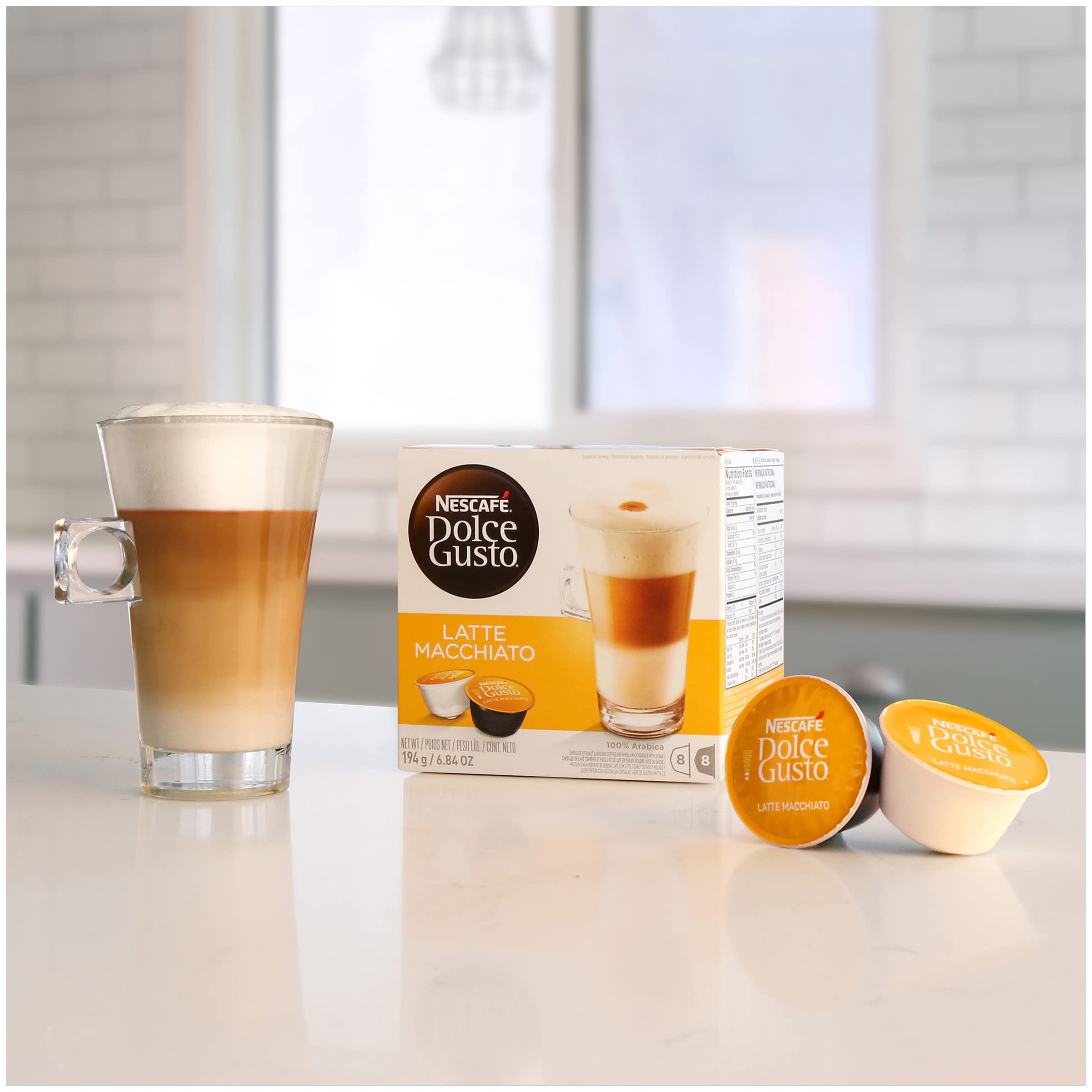 Nescafé Dolce Gusto latte macchiato on kitchen counter showing convenient home brewing