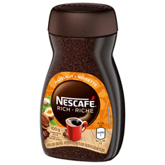 NESCAFÉ pouring into cup demonstrating quick preparation and smooth hazelnut flavor