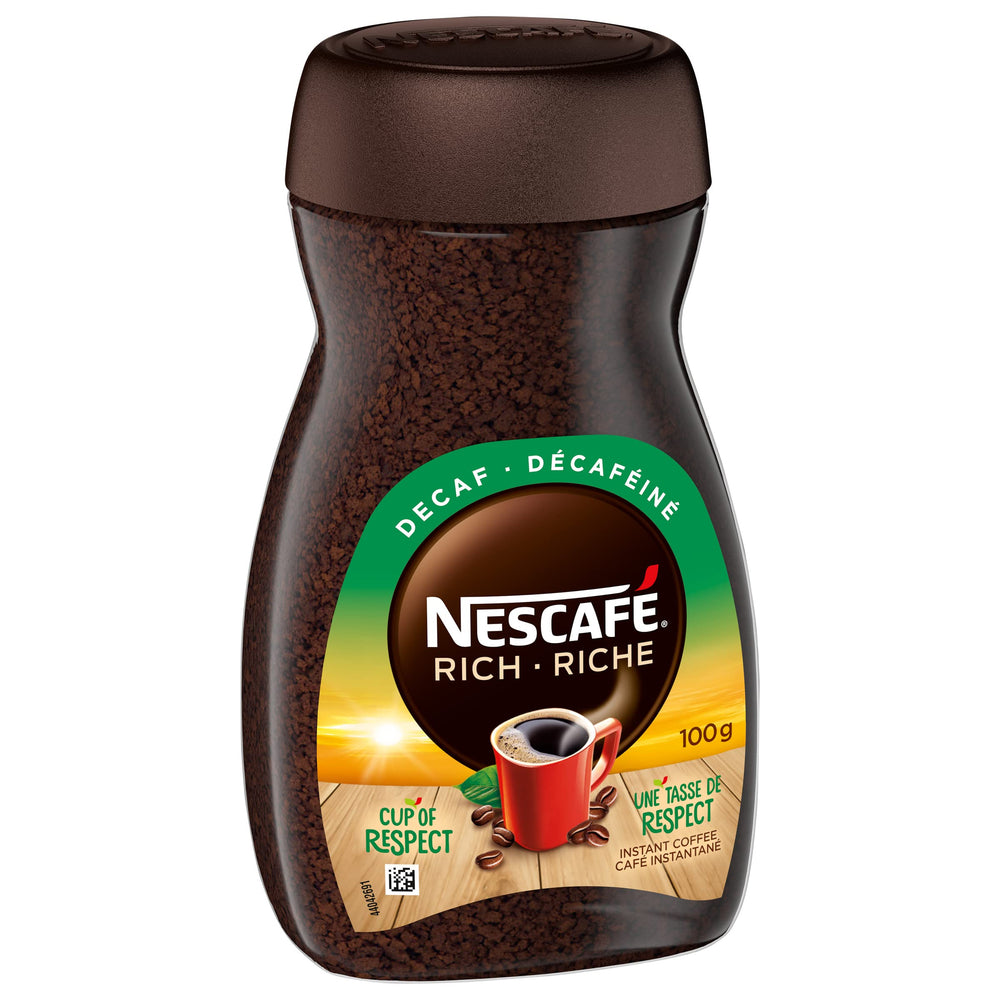 NESCAFÉ Rich decaffeinated jar open with dark instant granules visible, showing rich texture