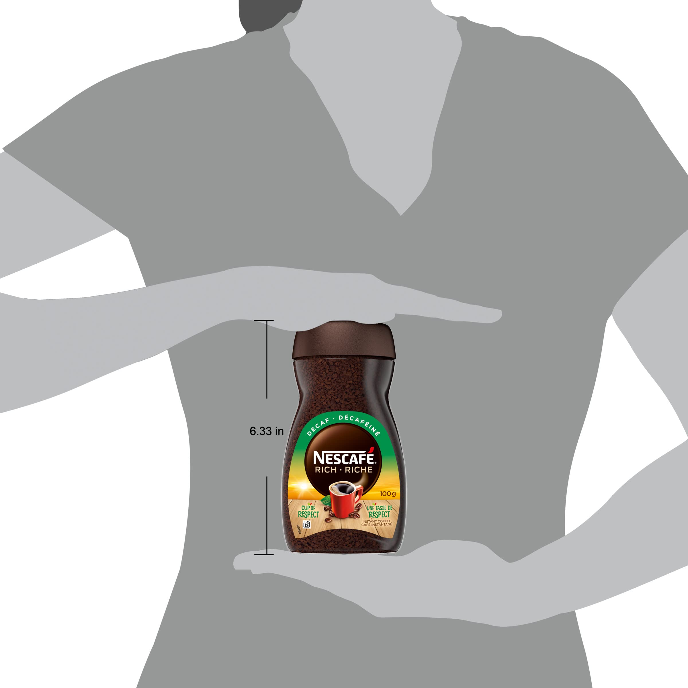 NESCAFÉ Rich decaffeinated next to a measuring spoon for scale, showing 100 g jar yield