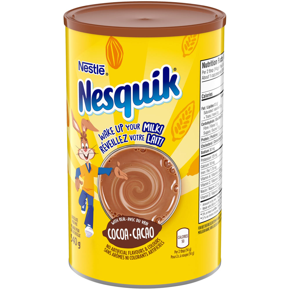 Glass of mixed Nesquik chocolate milk being poured for easy enjoyment