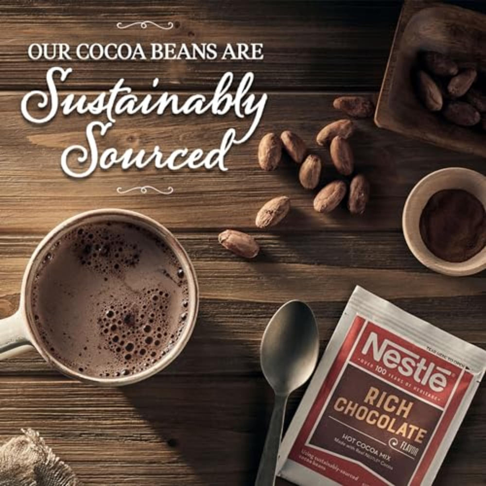 Nestle Hot Cocoa in a mug held by hand promoting warm comfort and ease