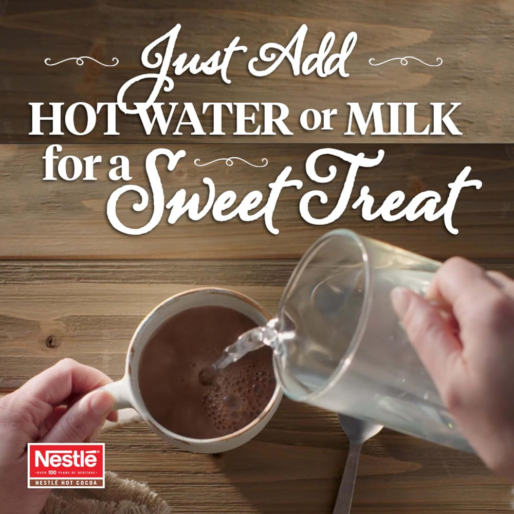 Nestle Hot Cocoa packet in hand showing single-serve portion and convenience