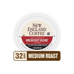 New England Coffee pods beside a hand for scale illustrating compact, travel-friendly size