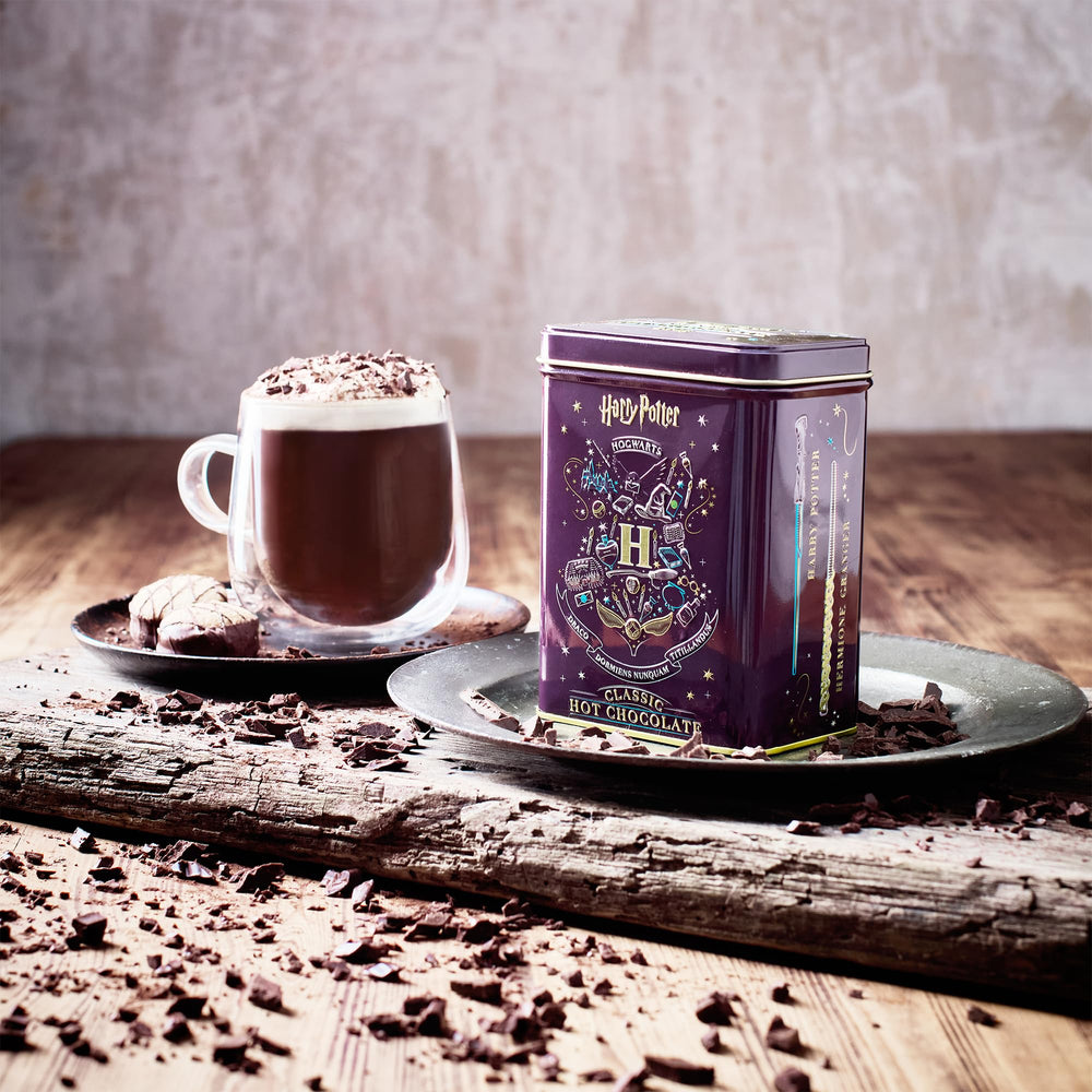 New English Teas tin side displaying Ron and Luna wand illustrations for collector interest