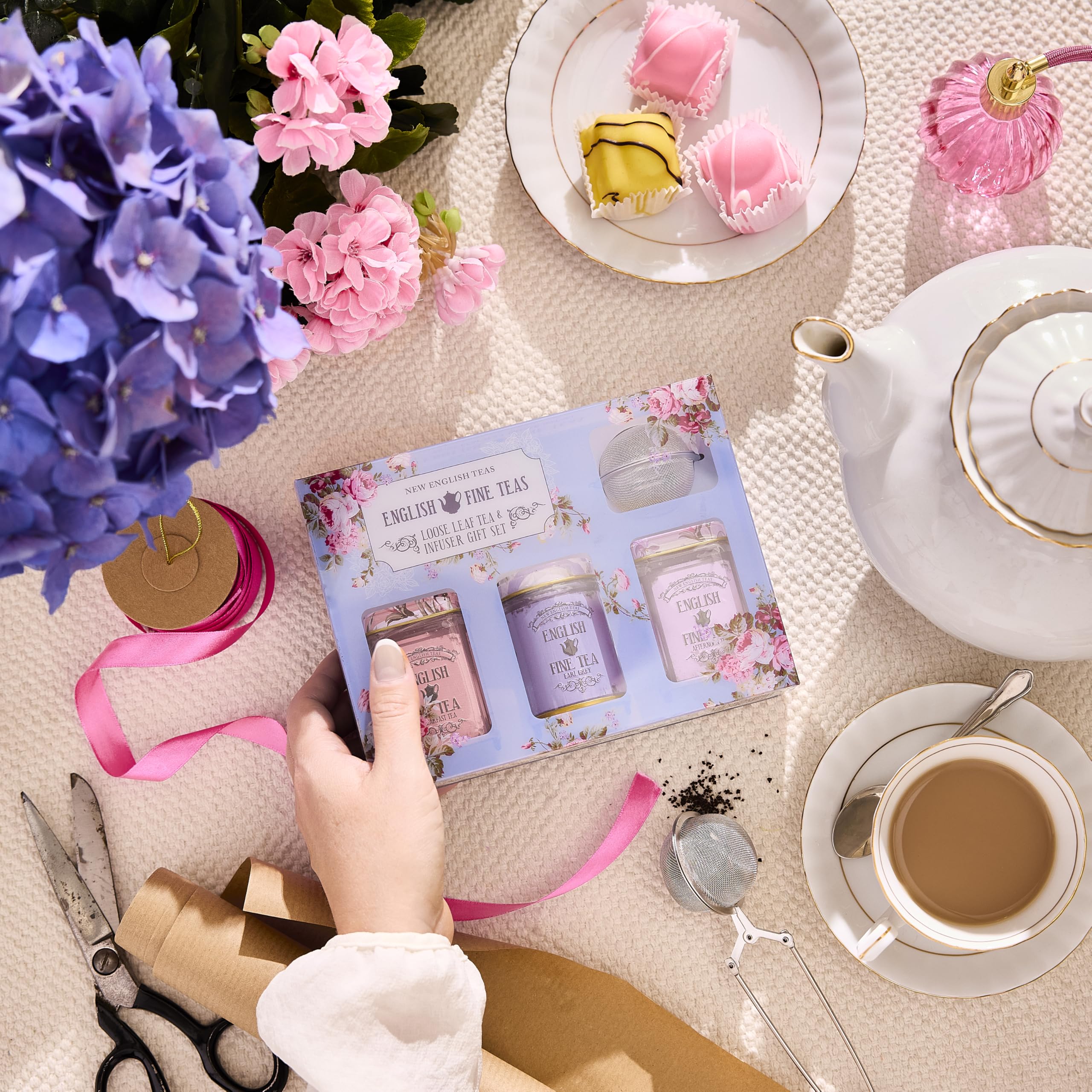 New English Teas close-up of collectible tins highlighting vintage floral detail and keepsake appeal