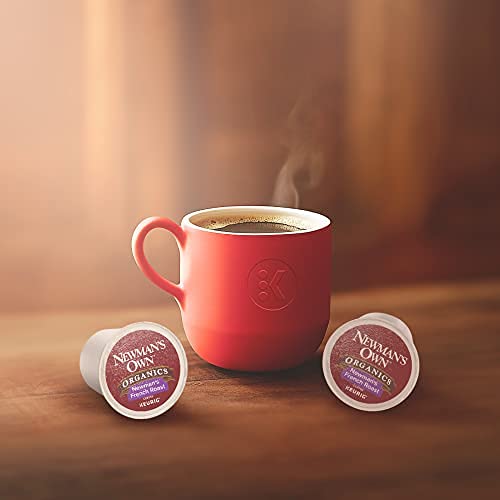 Newman's Own dark-roast beans and cup to show roast depth and chocolate notes