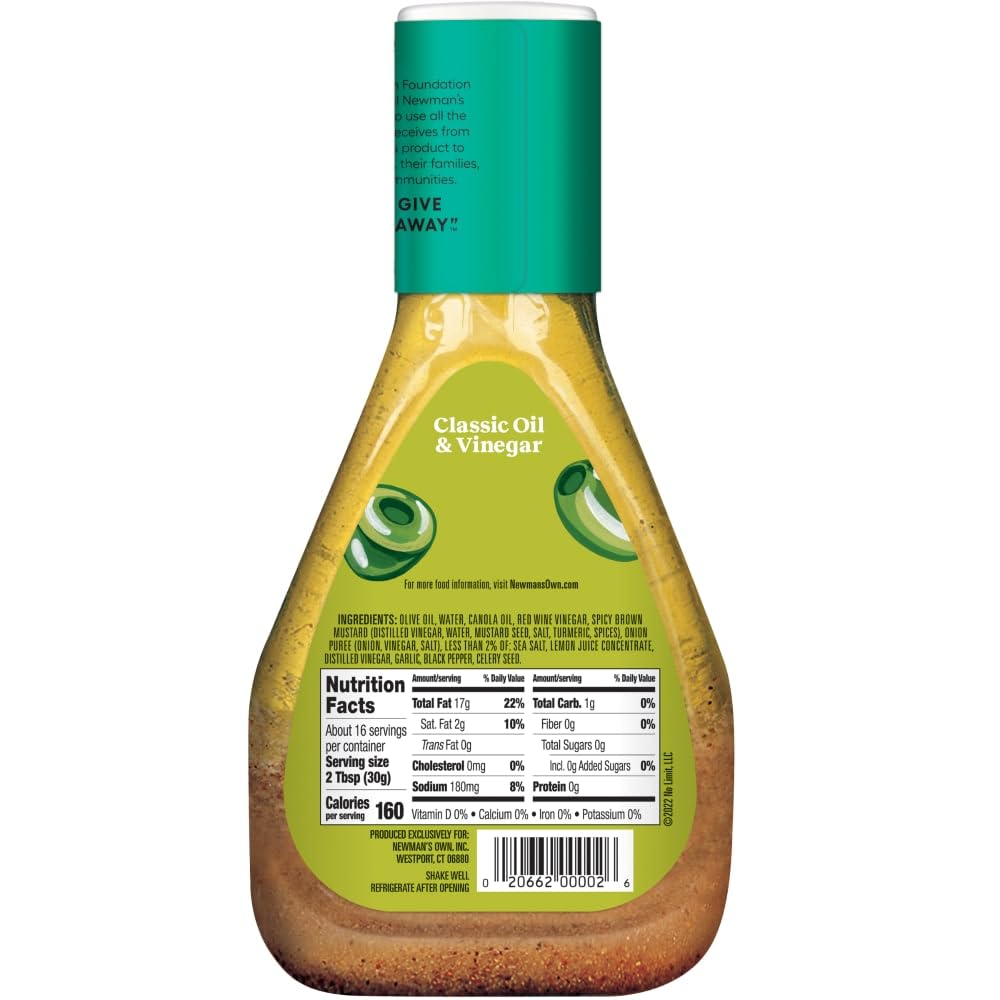 Newman's Own close-up drizzle showing smooth texture and cling on greens