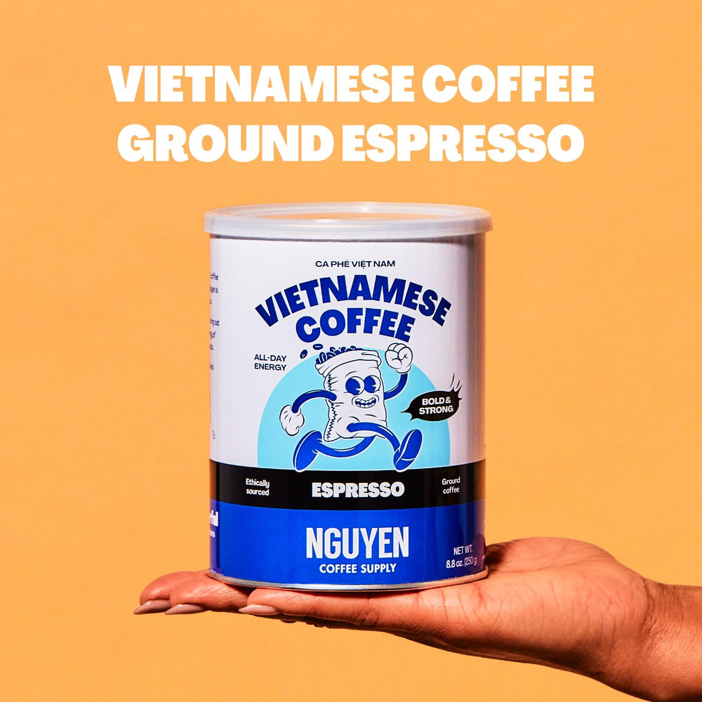 Nguyen Coffee Supply latte in hands showcasing how grounds hold up in milk drinks
