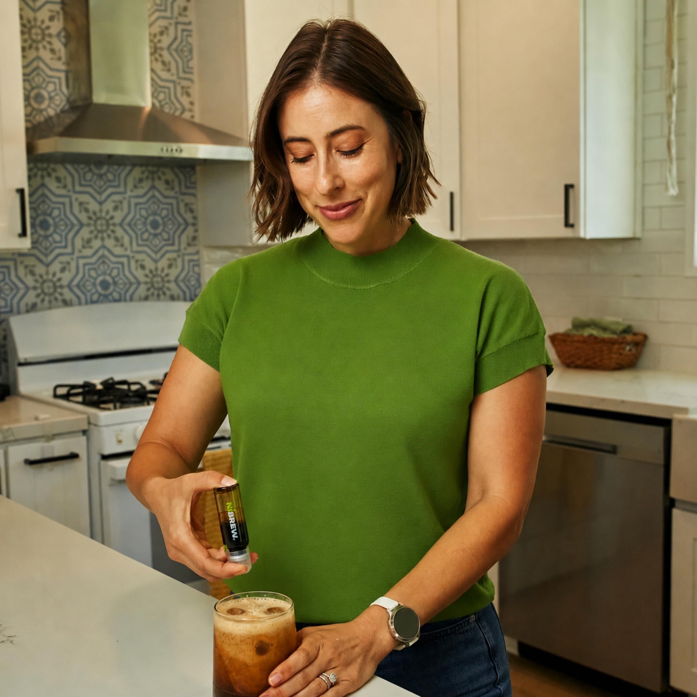 NiBREW iced nitro-style drink in hand offering quick energizing refreshment